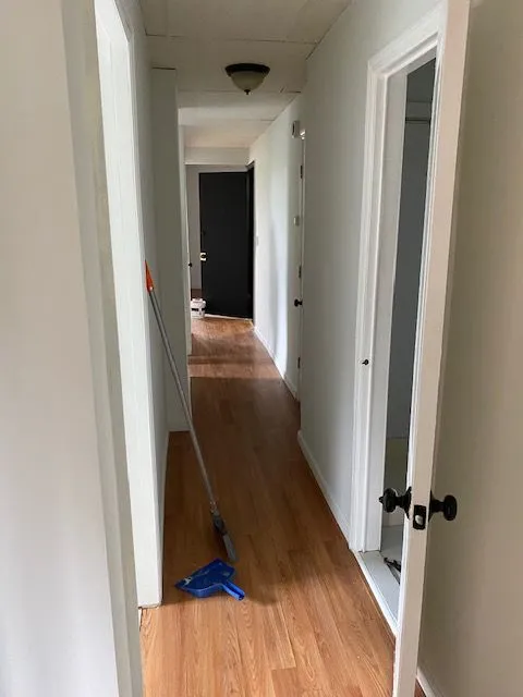 Hillside Ave #3S hallway with hardwood floors and doors to adjoining rooms